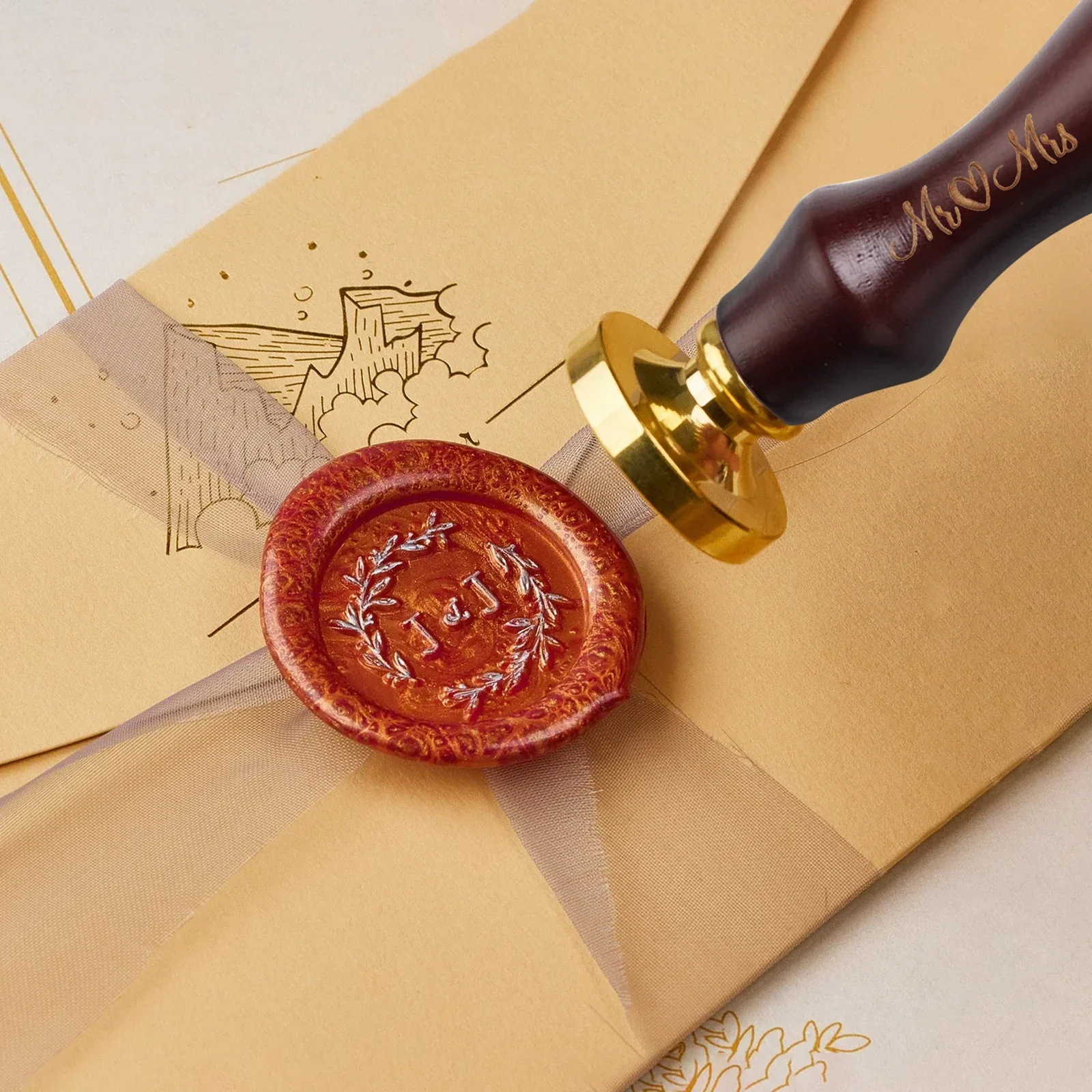 Wax seal stamp being used on an envelope